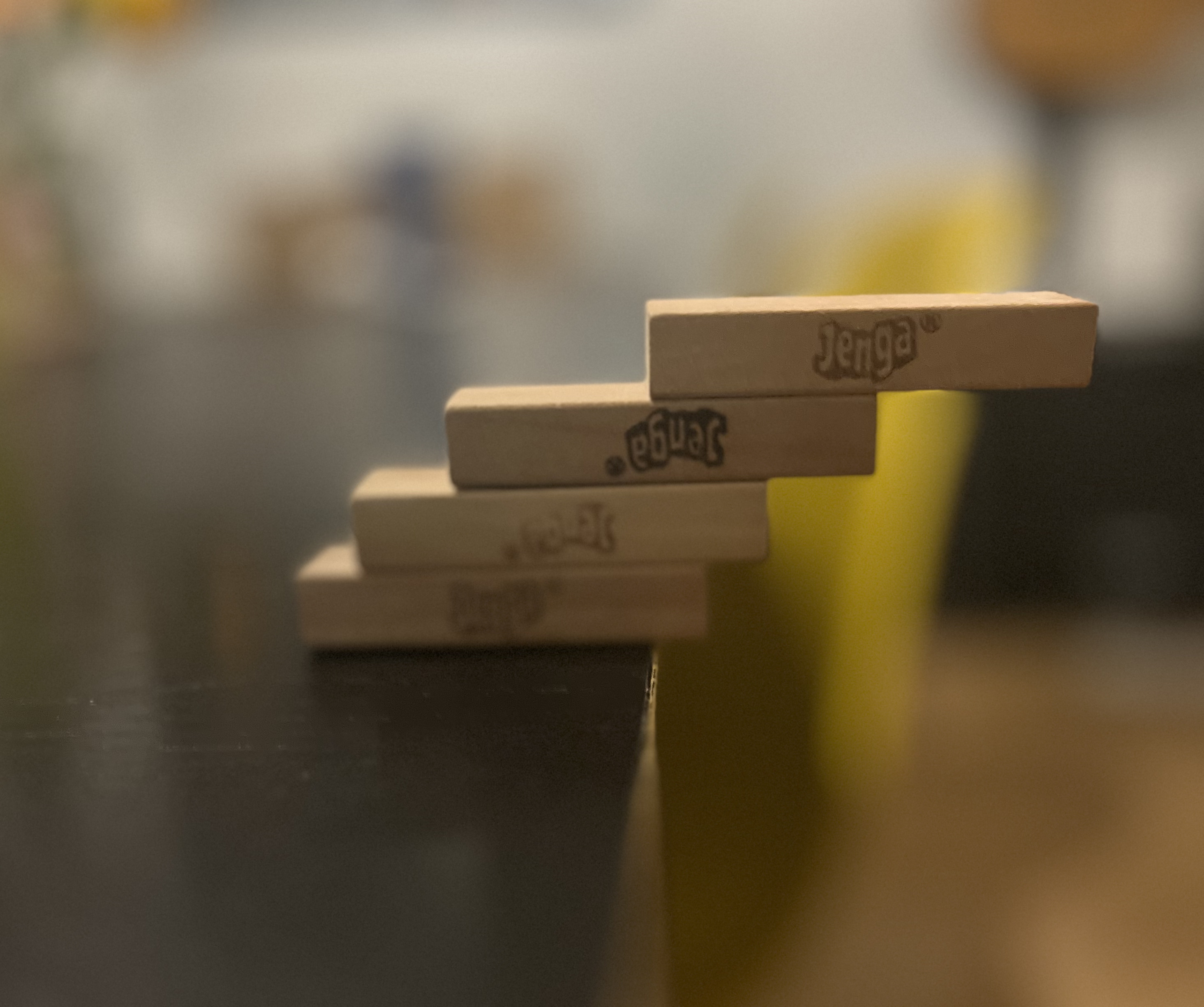 Jenga blocks form a precarious wooden staircase.