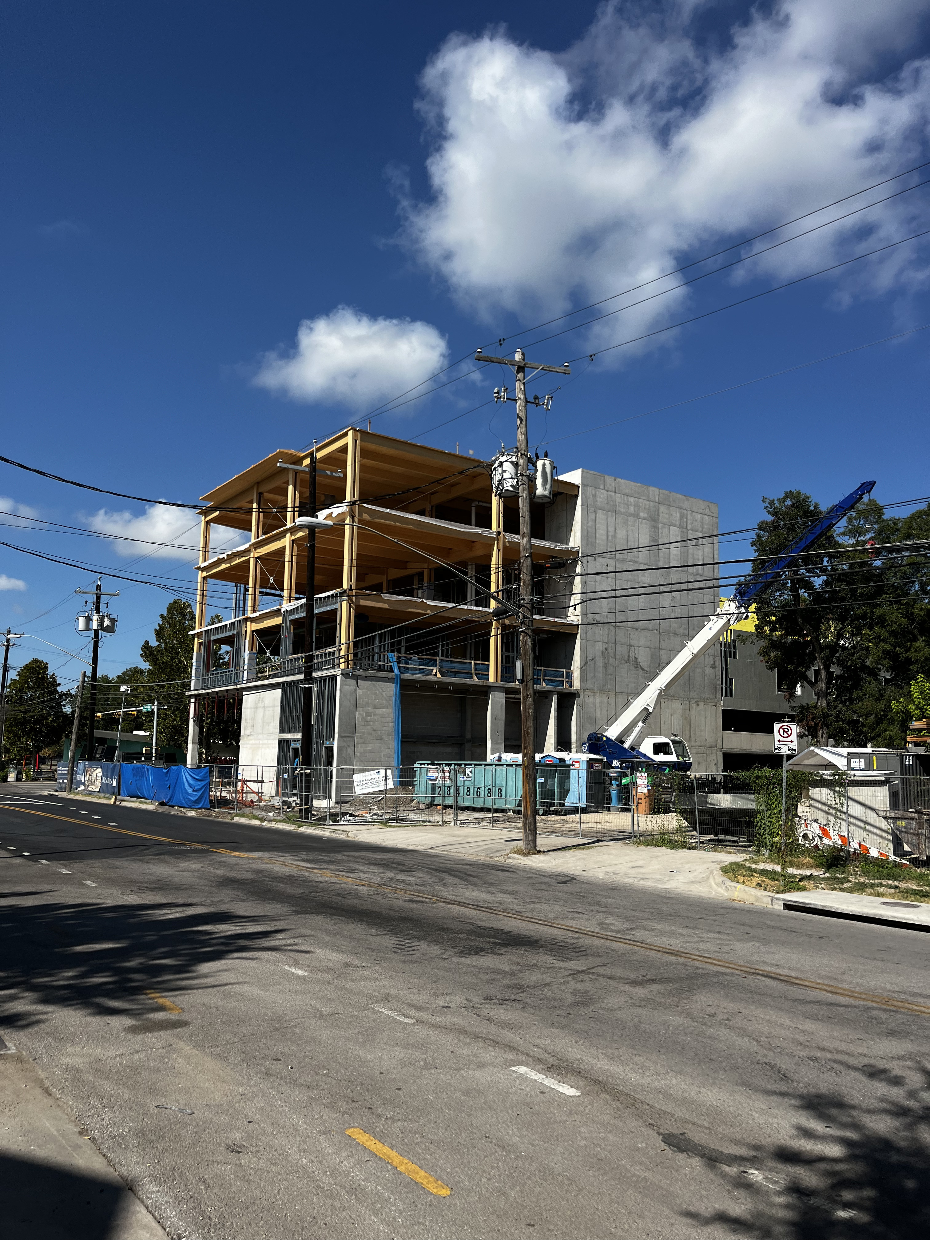 Construction underway: timber frame meets concrete core.
