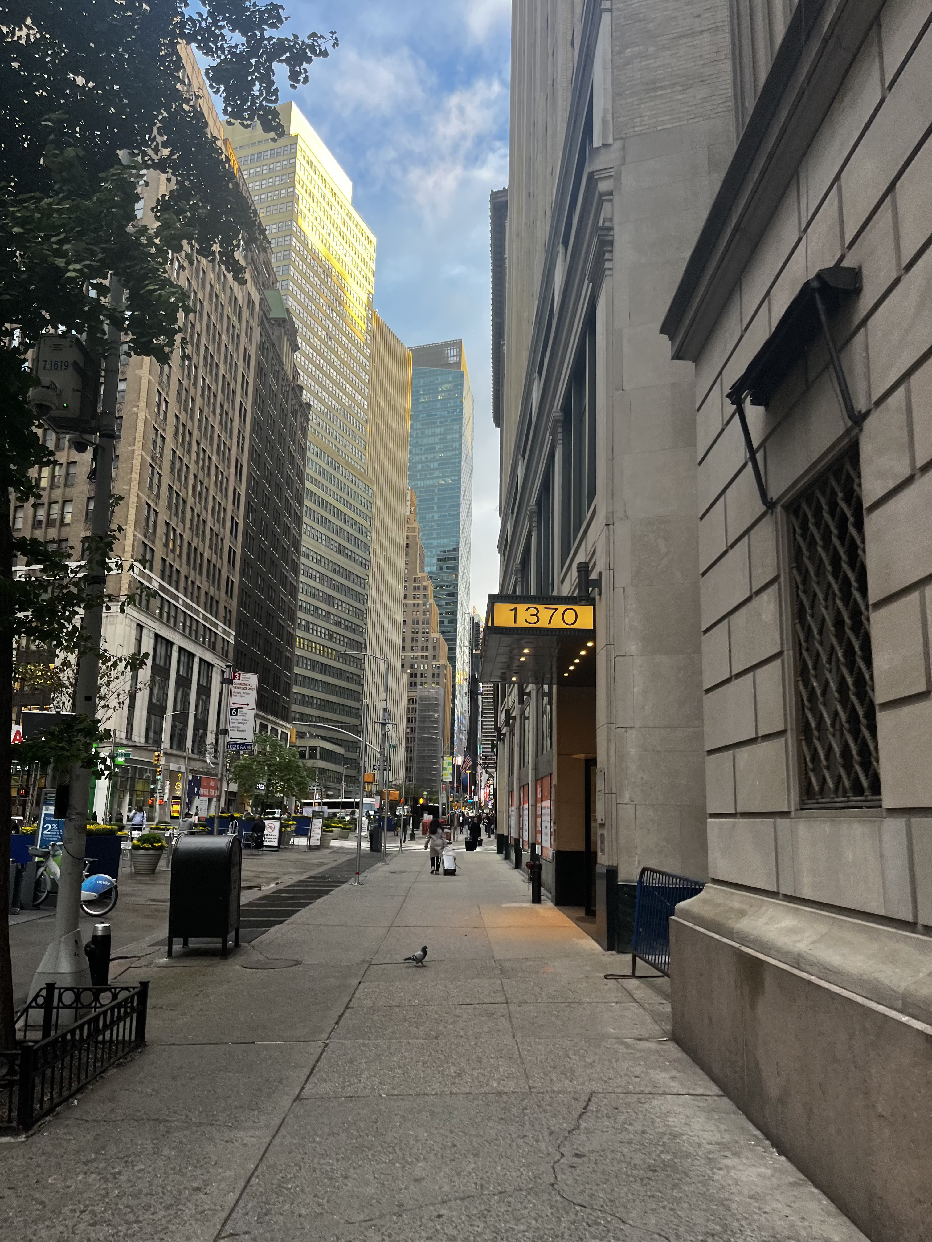 City street lined with towering buildings.