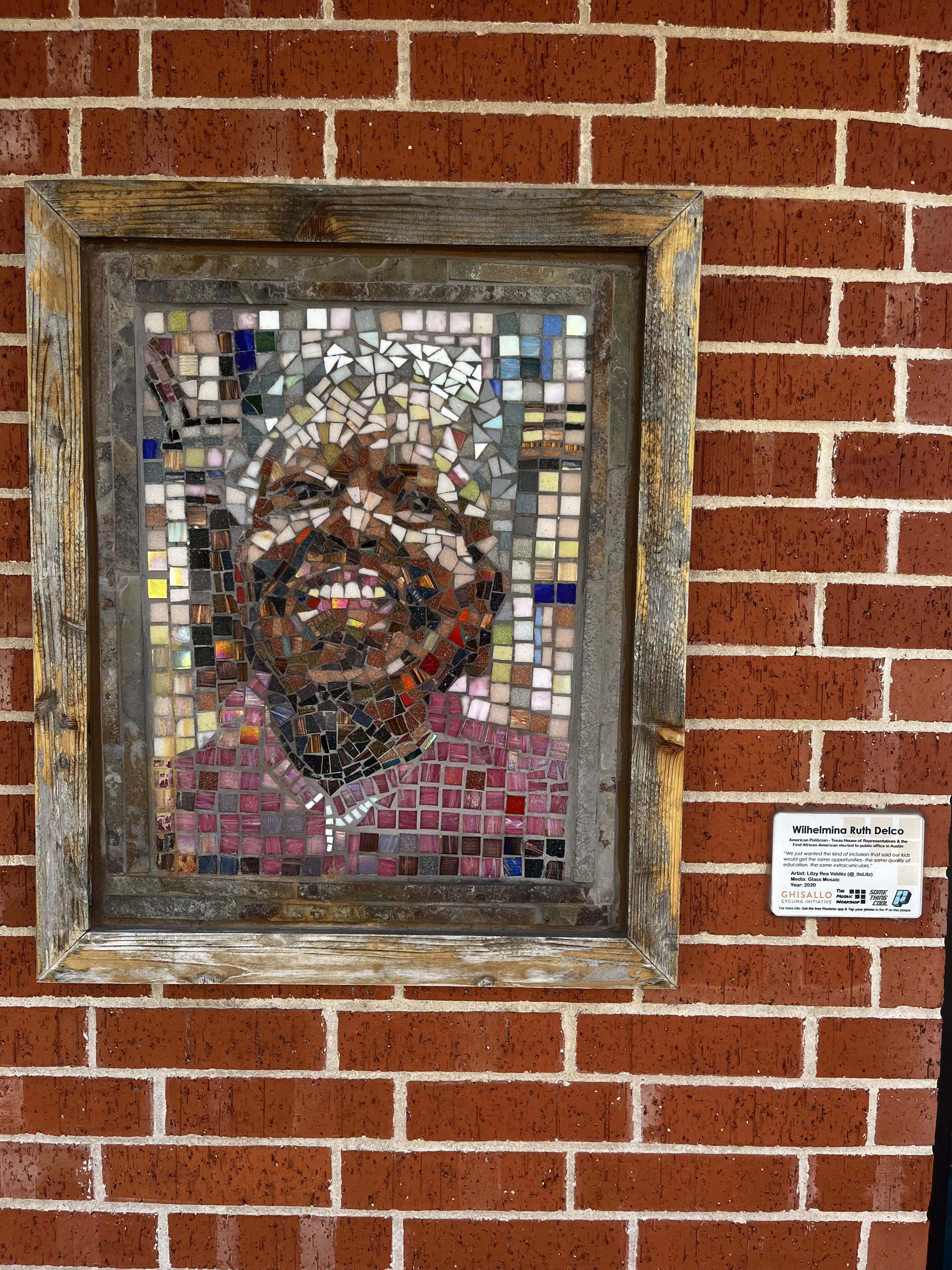 A glass mosaic portrait of Wilhelmina Ruth Delco.